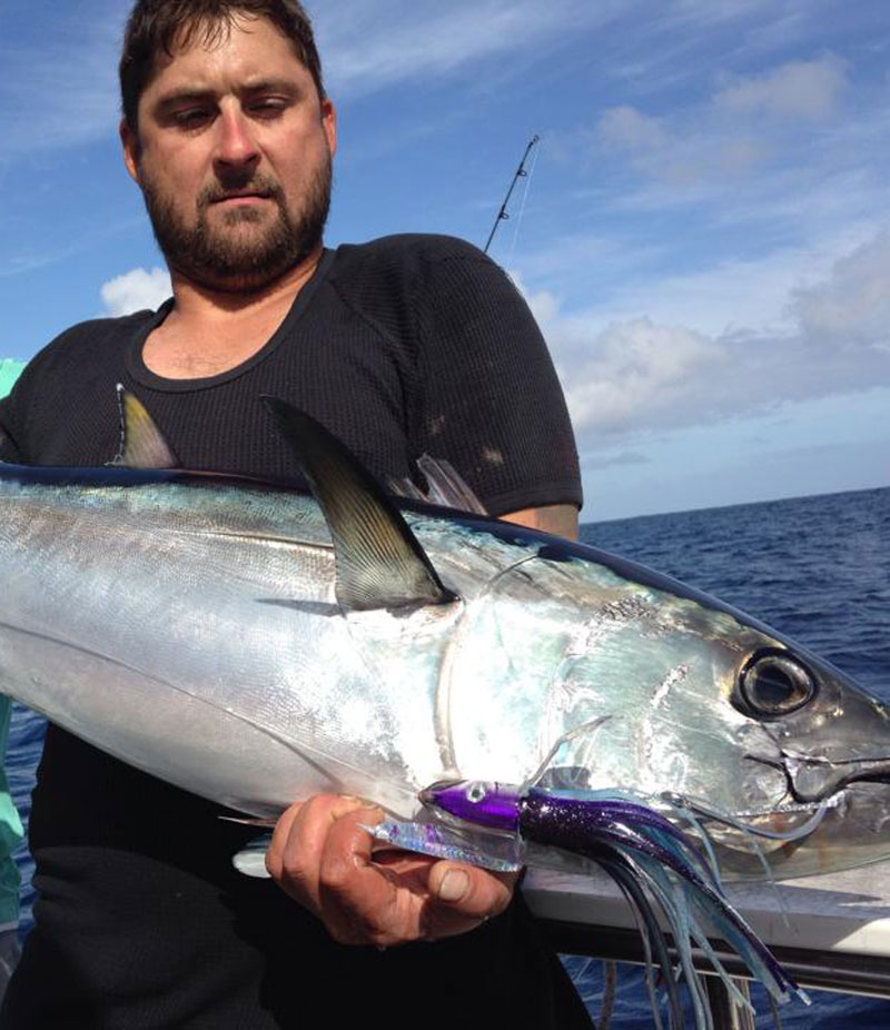 man holding Big tuna on portland Victoria fishing charter 2021